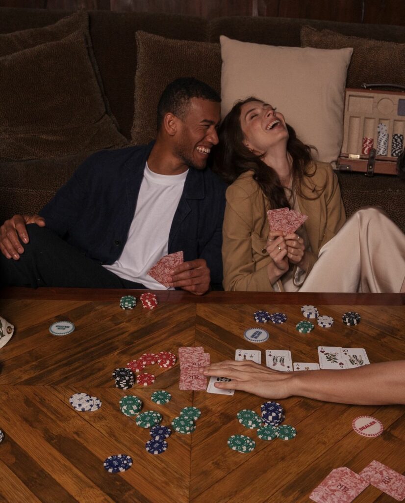 2 people seated for a board game night