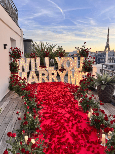 Romantic view of the Eiffel Tower at sunset with golden sky and soft lighting, perfect for a marriage proposal.