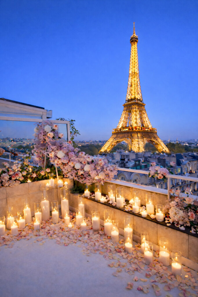 Fresh pink flowers and candle light in front of the Eiffel Tower